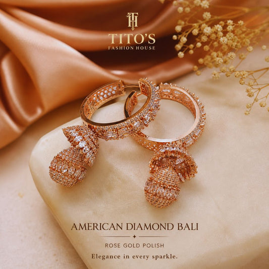 Rose gold earrings on a marble surface with TITO'S Fashion House branding.