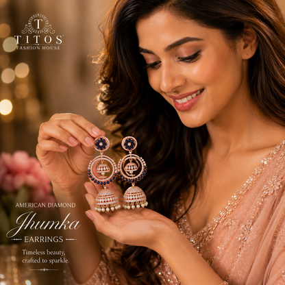 Woman holding and showcasing American Diamond Jhumka earrings with Titos Fashion House branding.