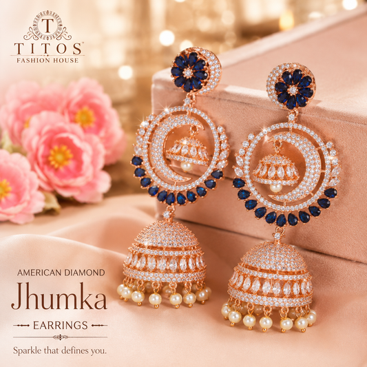 Ornate earrings with 'Titos Fashion House' branding on a soft background.