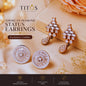 TITOS American Diamond Status Earrings on a soft background with brand name and product details.