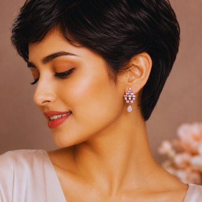 Close-up of a woman wearing elegant earrings with a blurred background