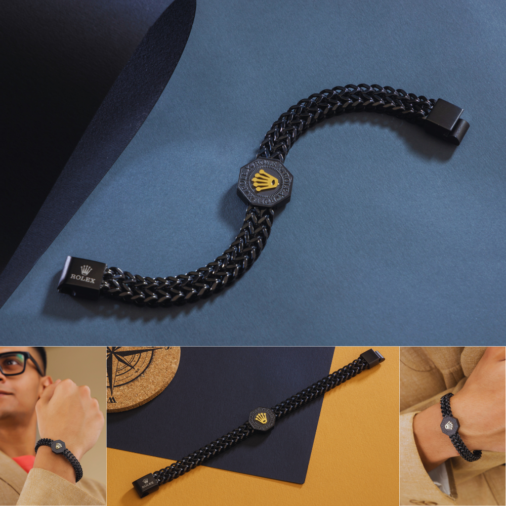 Black chain bracelet with a prominent brand logo on a blue background, with additional views of the bracelet on a person's wrist.