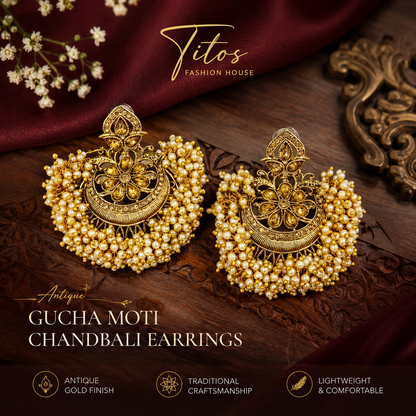Gold earrings on a wooden surface with 'Titos Fashion House' branding.