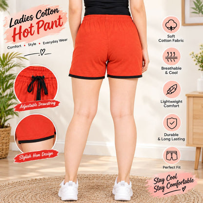 Cotton Hot Pants for Women. A person wearing bright red women's shorts with black trim and a black top, shown from the back in a home interior. The image includes marketing text and feature callouts for the shorts, such as adjustable drawstring, stylish hem design, soft cotton fabric, breathable and cool, lightweight comfort, durable and long lasting, and perfect fit.
