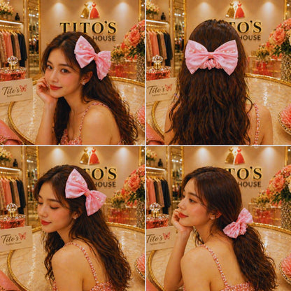 Woman wearing a pink hair bow in a store setting with 'Tito's House' branding.