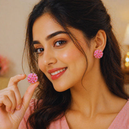 Woman wearing pink floral earrings and smiling