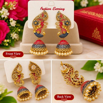 Three-panel product collage showing ornate gold-toned jhumka earrings with red and blue enamel detailing and pearl bead drops. The top panel shows the earrings on a display card labeled 'Fashion Earring'; the bottom panels show front and back views on white cards, with floral and red box props in the background.