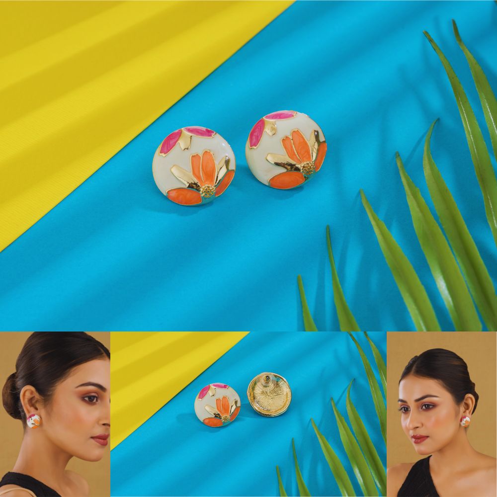Colorful floral earrings on a blue and yellow striped background with a woman wearing them.