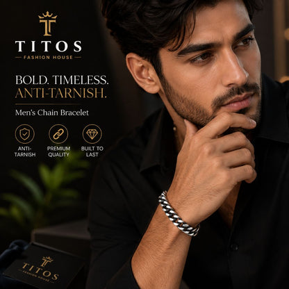 Man wearing a TITOS men's chain bracelet with brand logo and text.