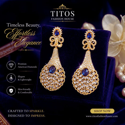 Gold earrings with blue stones on a dark background with TITOS Fashion House branding.