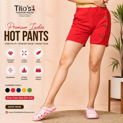 A model wearing bright red hot pants with decorative buttons and pink slip-on shoes, shown in a styled indoor setting with promotional text and icons for Tito's Fashion House.
