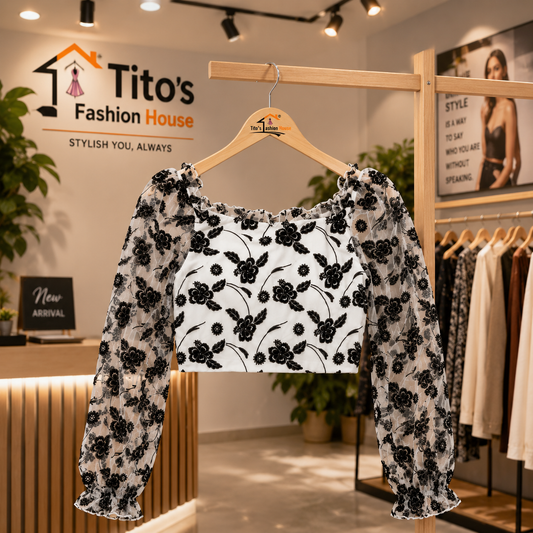 Floral blouse on a hanger with Tito's Fashion House logo in the background